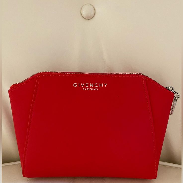 Brand New In Box Givenchy Faux Leather Pouch Bag. Measures: 7"W X 4.5" H X 3"D - Cherry Red In Color - Silver Zipper & Givenchy Logo For The Zip-Pull - Large Givenchy Logo Embossed On Frontside - Mini Givenchy Logos Throughout Interior Red Cosmetic Bag With Zipper, Modern Red Bags With Zipper Pouch, Red Zipper Cosmetic Bag, Red Cosmetic Bag With Zipper Closure - Gift, Evening Clutch Cosmetic Bag With Zipper, Chic Red Rectangular Pouch, Red Evening Pouch, Red Rectangular Cosmetic Bag With Zipper, Red Rectangular Cosmetic Bag With Zipper Closure