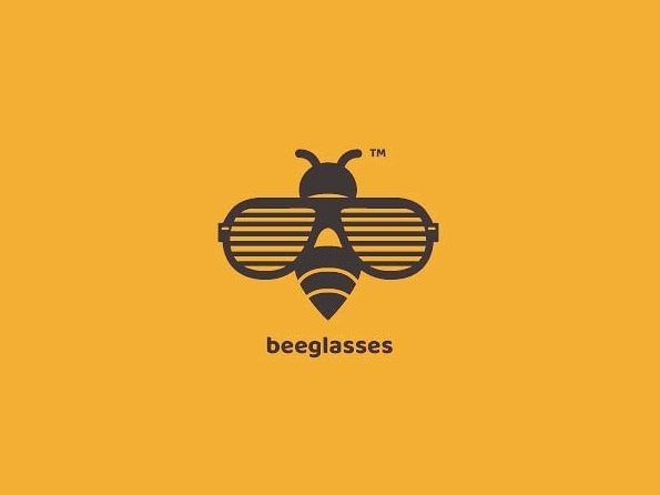 a bee with glasses on it's face and the words beeglasses above it