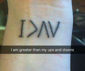 a wrist tattoo with the words i am greater than my ups and downs