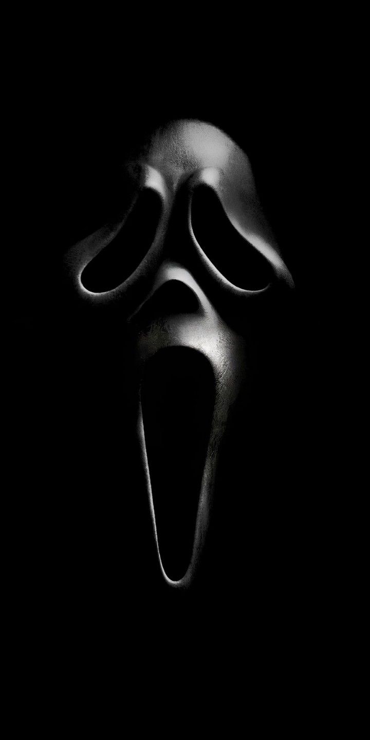 a black and white photo of a scream mask