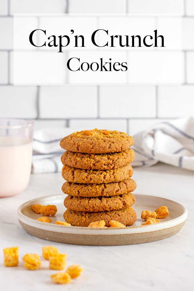 a stack of cookies sitting on top of a plate next to a glass of milk