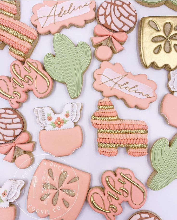 many decorated cookies are displayed on a white surface