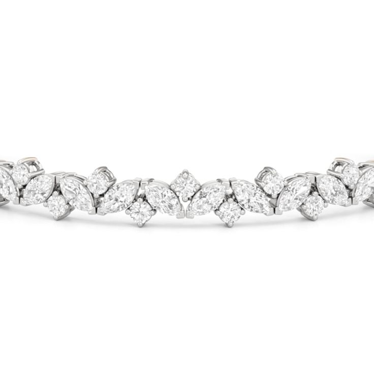 An absolute showstopper, this diamond tennis bracelet will have all eyes on your wrist. It features marquise diamonds and round diamonds arranged in a fanciful pattern to create a row of diamonds with gently undulating arches. This tennis bracelet is lovely on its own, but lovelier when worn with bangles and dainty chains. Round Diamond Tennis Bracelet, Marquise Diamond Bracelet, Expensive Jewelry Luxury, Infinity Pendant, Diamond Tennis Bracelet, Jewelry Luxury, Expensive Jewelry, Diamond Bangle, Tennis Bracelet Diamond