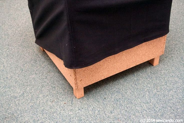 a close up view of the back end of a chair with a black cover on it