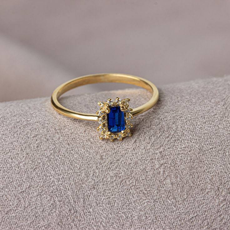 Sapphire symbolizes loyalty, love and longing. It gives positive vitality with the magnificent energy of its color. Our rectangular sapphire stone ring surrounded by real diamonds will add elegance to your hands. It is a ring that you can use both on special occasions and in daily life. It is a beautiful and stylish product that you can gift to yourself and your loved ones. Our necklace compatible with our ring: https://queenjewelryturkey.etsy.com/listing/1442666284/genuine-diamond-rectangle-sap Rectangle Gemstone Ring, Rectangle Sapphire Ring, Gold Sapphire Ring For Anniversary, Radiant Cut, Gold Radiant Cut Sapphire Ring For Anniversary, Elegant Sapphire Promise Ring With Rectangular Stone, Radiant Cut Gold Sapphire Anniversary Ring, Elegant Rectangular Sapphire Ring For Anniversary, Gold Sapphire Diamond Ring With Halo Design, Sapphire Ring With Rectangular Stone And Prong Setting