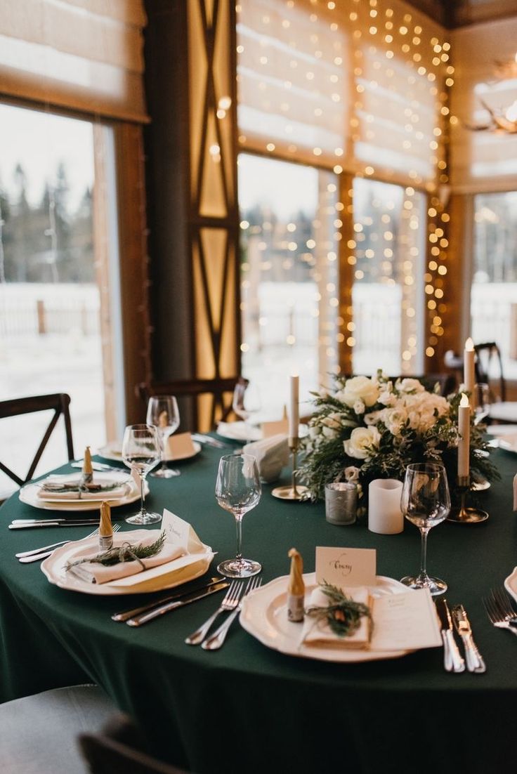 the table is set with place settings for dinner