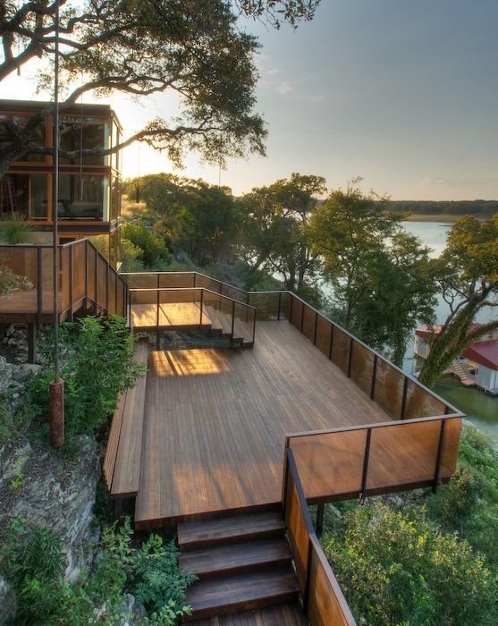 a wooden deck with stairs leading up to it