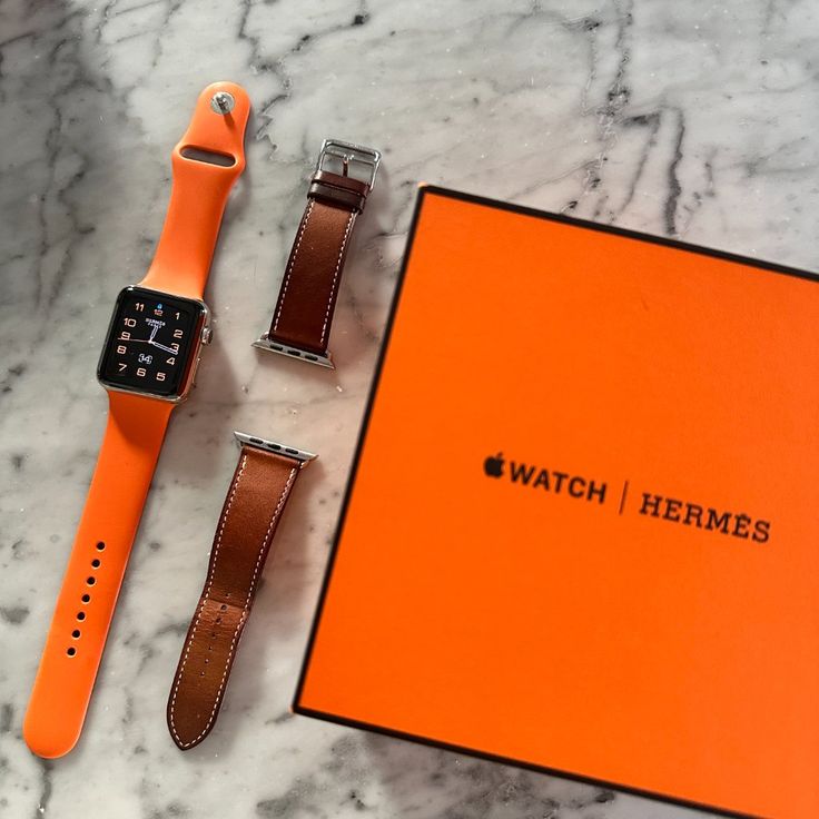 This Hermes Apple Watch Is Super Versatile And Timeless. The Perfect Mix Of Sporty And Classic. You Can Wear It For Your Workouts / Athletic Activities With The Distinguished Hermes Orange Band And You Can Switch It Up For A More Classic Look With The Luxurious Brown Leather Band. This 42mm 2nd Generation Hermes Apple Watch Comes With All Of The Original Packaging And Parts: Two Bands (Orange Rubber And Brown Leather), The Original Hermes Orange Box And White Watch Box + Apple Watch Charger. Not Hermes Apple Watch, Apple Watch Charger, Orange Box, Hermes Orange, Apple Watch 42mm, Apple Watches, Hermes Accessories, Watch Charger, White Watch