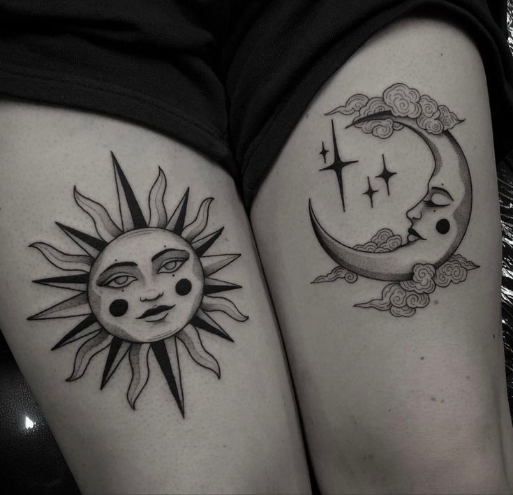 two sun and moon tattoos on both thighs, one is black and the other is white