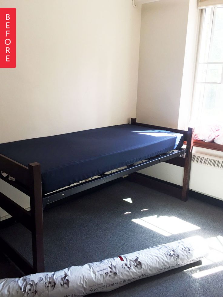 a bunk bed sitting in the corner of a room with an air mattress on it