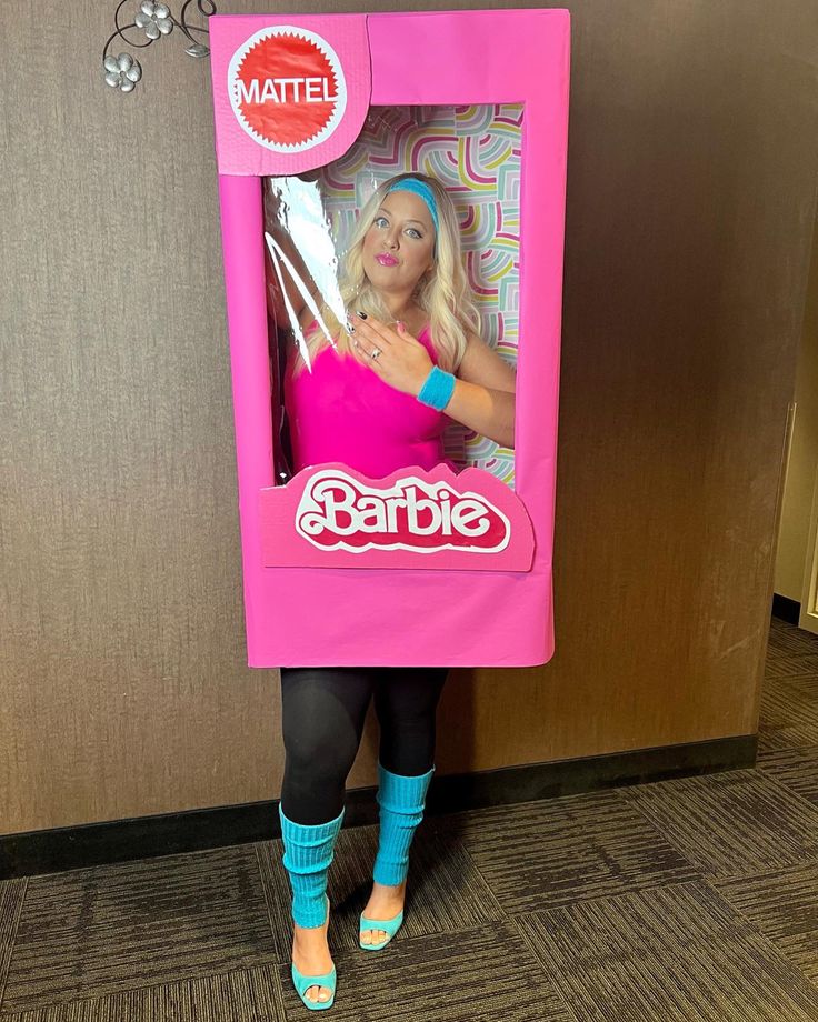 a woman in a barbie doll box costume