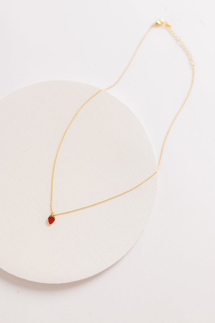 Delightful strawberry charm necklace 16" chain Approximate charm measurement - 1/4" Gold plated Jewelry Care: Lightly polish each jewelry piece with a soft cloth after wearing. Remove rings when washing hands. Do not shower or swim with your jewelry. Delicate Drop Charm Necklace For Gifts, Minimalist Red Birthstone Jewelry, Dainty Red Jewelry For Everyday, Red Jewelry With Adjustable Chain For Gift, Gift Red Jewelry With Adjustable Chain, Dainty Red Birthstone Jewelry, Red Dainty Birthstone Jewelry, Red Drop Necklace For Gift, Red Drop Jewelry For Gift