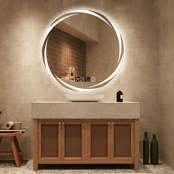 a bathroom with a round mirror above the sink