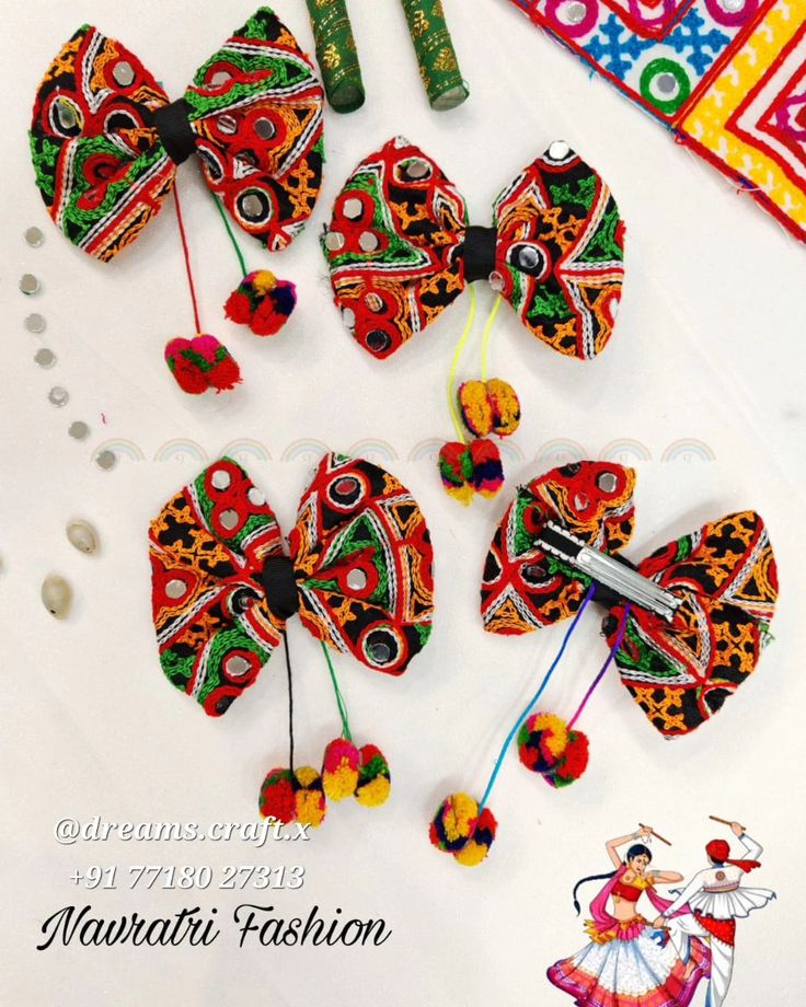 several pieces of colorful hair accessories on a white surface with scissors and beads next to it