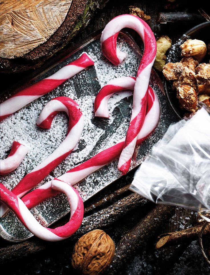 some candy canes and nuts on a table