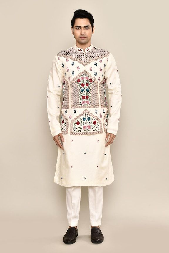 Ivory bundi with thread, sequin embroidery in mughal floral pattern. Paired with floral embroidered kurta and pant pyjama. - Aza Fashions Off White Bandhgala For Festive Occasions, Festive Off White Bandhgala, Festive Off-white Bandhgala For Transitional Season, Cream Bandhgala With Chikankari Embroidery For Transitional Season, Off White Cutdana Sherwani For Festivals, Festive Off White Nehru Jacket With Traditional Drape, Wedding Nehru Jacket With Mirror Work, Festive Off-white Nehru Jacket With Traditional Drape, White Chanderi Sherwani With Mirror Work