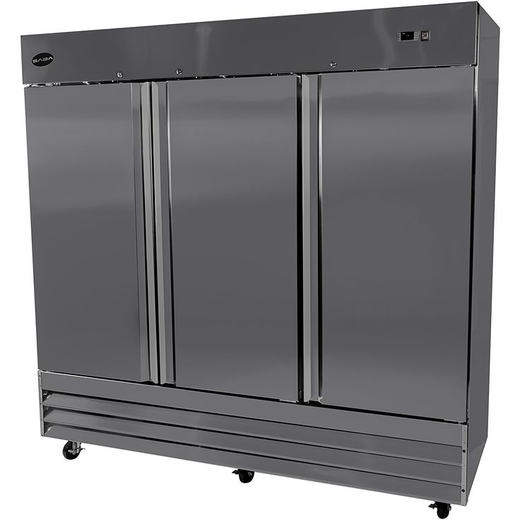 a double door refrigerator sitting on top of a metal cart with two doors and wheels