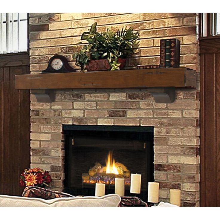 a living room with a fire place and candles