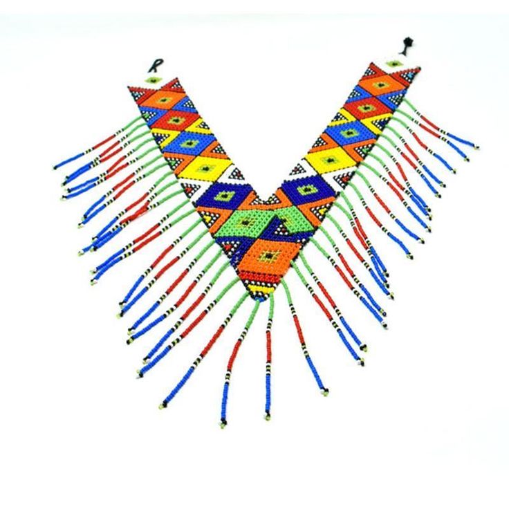 This beautiful beaded bold and authentic colored necklace is handmade by the Maasai women. We directly work with Maasai artisans to produce and market high-end beaded jewelry based on traditional beading techniques infused with modern aesthetics. Maasai women are skilled artisans who are world wide known for their use of colorful glass beads. Maasai culture is highly patriarchal and it is the women who are hurt the most by issues of structural inequality. With us working directly with them, they Maasai Culture, Plain Tee Shirts, Colored Necklace, Beading Techniques, Beaded Collar, Plain Tees, Maasai, Evening Outfits, Colourful Necklace