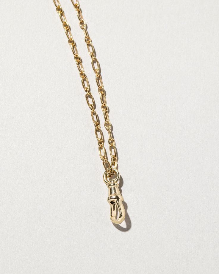 Item Details Complimentary solder with purchase of a Mociun chain of your choice Set in 14k yellow gold Size small measures 15mm, medium measure 19mm, and large measures 22mm in total length How to Wear: We recommend wearing this piece on your favorite chain to show off your charm collection or to keep your rings safe when not on your fingers. We find medium and large sizes best for rings and size small best for a single charm. Timeless Pendant Jewelry With Cable Chain, Timeless 14k Gold Jewelry With Rectangular Links, Formal Jewelry With Adjustable Chain In Recycled Gold, Formal Recycled Gold Jewelry With Adjustable Chain, Recycled Gold Link Jewelry For Gifts, Recycled Gold Link Jewelry Gift, Yellow Gold Jewelry With Round Pendant Box Chain, Yellow Gold Pendant Chain Jewelry, Yellow Gold Brass Box Chain Jewelry