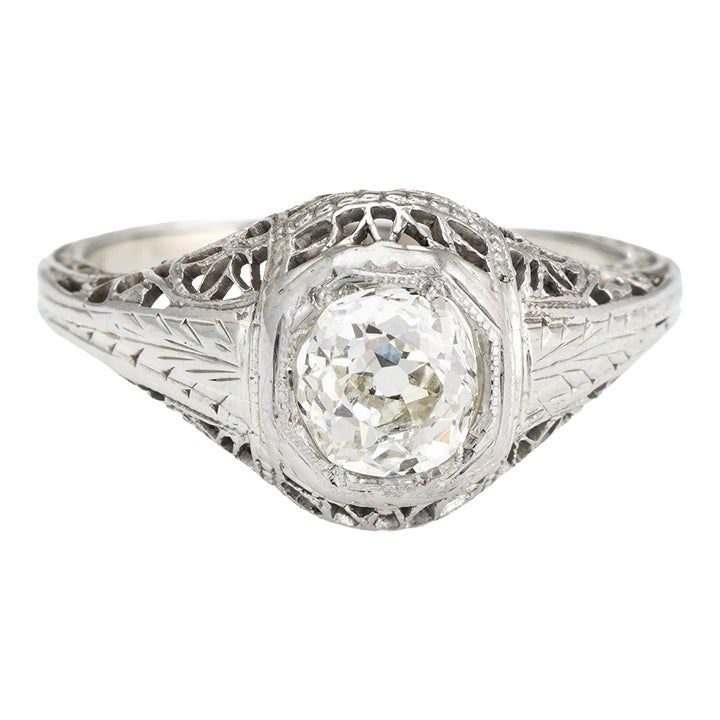 Elegant & finely detailed Art Deco era ring (circa 1920s to 1930s), crafted in 18 karat white gold.   Centrally mounted estimated 0.60 carat Old Mine cut (estimated at K-L colour and SI2 clarity).     The ring epitomises vintage charm and would make a lovely alternative engagement ring. The lacy filigree gallery mount terminates to the round bezel setting. The diamond faces up nicely and offers good sparkle and fire. Also great worn as a right hand or cocktail ring.    The ring is in very good c 1900s Engagement Ring, Antique Engagement Rings Victorian, Antique Ring Settings, Engagement Jewellery, Art Deco Diamond Ring, Deco Diamond Ring, Antique Diamond Engagement Rings, Edwardian Engagement Ring, Detailed Art