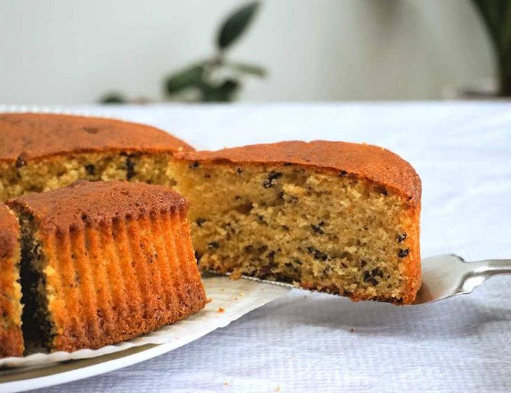 a cake on a plate with a slice cut out