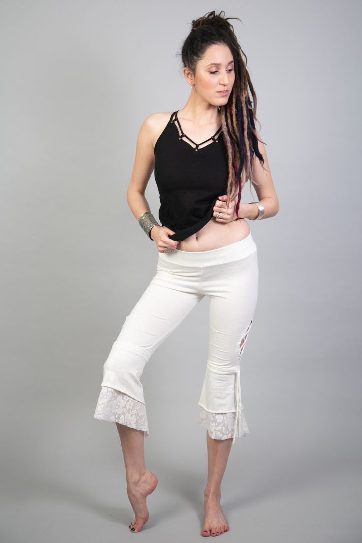 "American Tribal Style white lace leggings pants for women. These boho-hippie pants are wonderful for tribal fusion and belly dance and many more purposes. Our lace bottoms would be a great addition to your wardrobe and also a lovely gift. ❀ Features: ✓ 95% natural cotton and 5% lycra fabric ✓ Side opening with x tying ✓ Seven-eighths length ✓ Comfortable elastic at the waistline Stands on its own and can also be matched with a mini skirt > https://etsy.me/2C6Yzsv Matching top > www.etsy.c White Lace Trim Bottoms For Festival, White Bohemian Yoga Pants, White Stretch Harem Pants For Yoga, White Stretch Bottoms For Festivals, Bohemian White Yoga Bottoms, Summer Festival Leggings, Stretch Lace Bottoms For Festival, Summer Festival Stretch Yoga Pants, Summer Festival Stretch Leggings