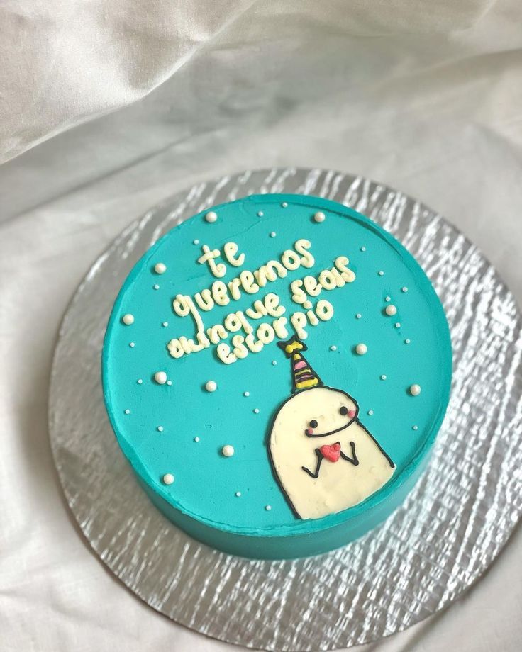 a birthday cake with an image of a cartoon character on the frosting and writing