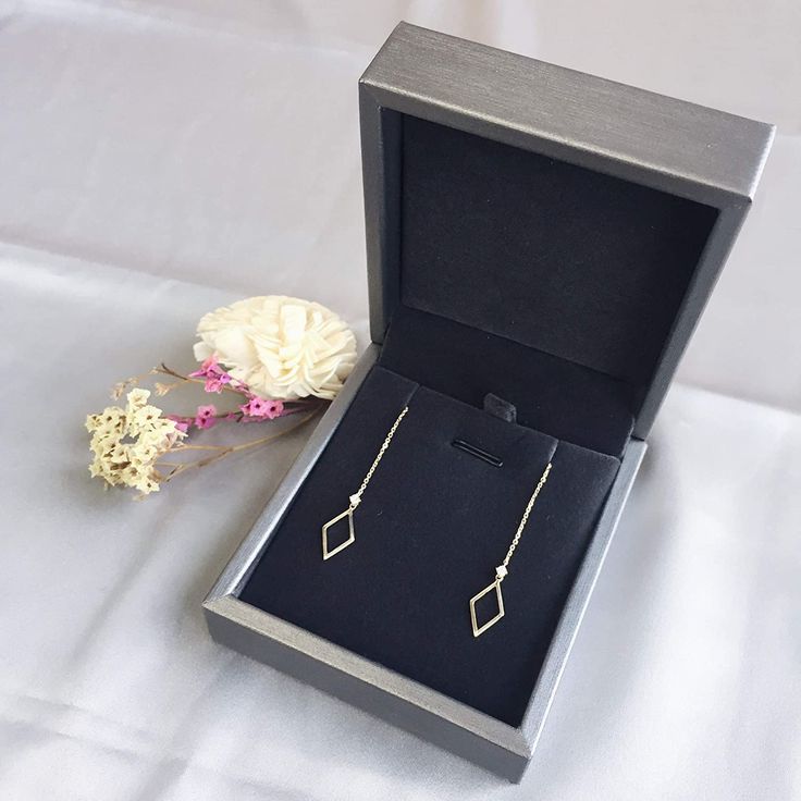 Distinctly stylish, these unique threader earrings feature a modern design sure to make a statement. 2 natural diamonds reflect more lights, makes it sparking and eye-catching. Minimalist design fits for casual wear as well as party events. Made with 14k gold and Natural Diamond. Threader length: 13.2cm Geometric Measure:0.63*0.31in / 16*8mm Diamond weight: 0.07ct / 2 Stones in total Diamond Clarity: SI3 Total weight: 1.05g Modern Jewelry With Diamond Markers As Gift, Modern Diamond Cut Diamond Earrings For Gift, Modern Diamond Dangle Earrings For Gift, Modern Diamond Earrings With Accents For Gift, Modern Diamond Dangle Earrings As Gift, Modern Diamond Earrings With Accents As A Gift, Modern Dangle Diamond Earrings As Gift, Modern Dangle Diamond Earrings For Gift, Elegant Earrings With Diamond Markers As Gift