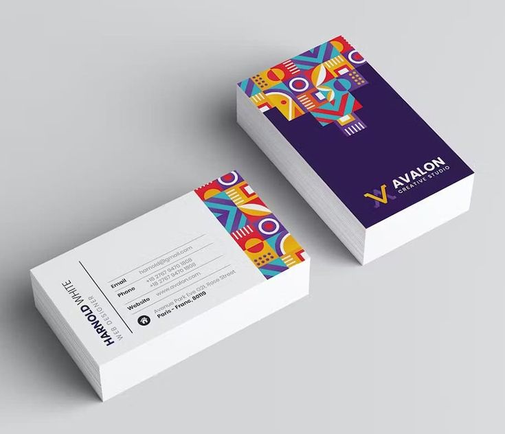 the business card is designed to look like it has colorful designs on it and an abstract pattern