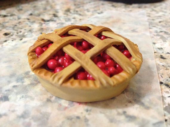 a cherry pie sitting on top of a counter