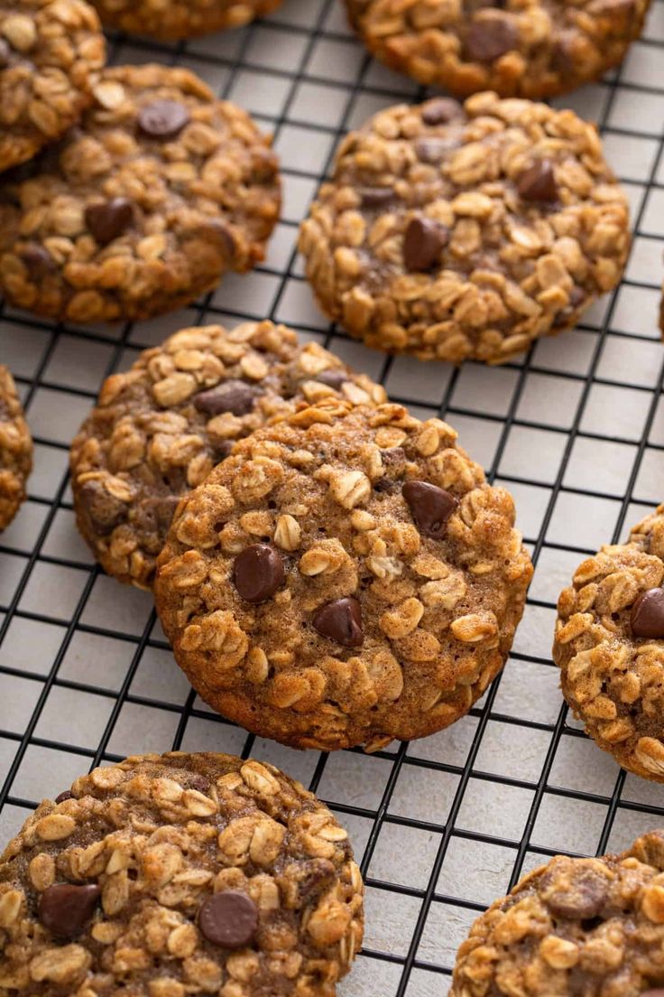 chocolate chip oatmeal cookies cooling on a rack