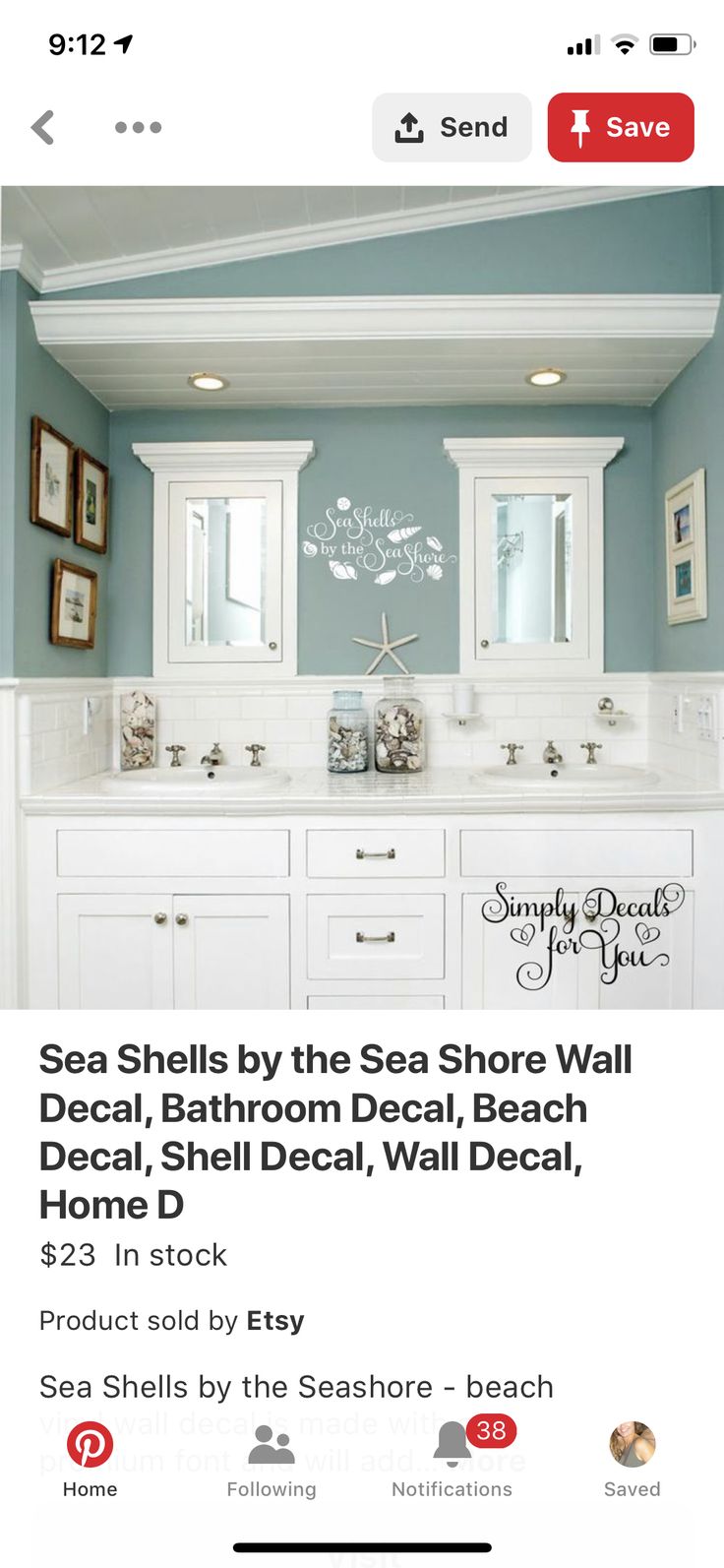 a bathroom with blue walls and white cabinets on the bottom right hand corner is an ad for sea shells by the sea shore wall decal