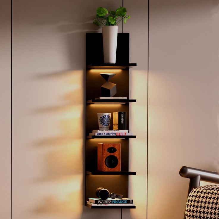 a shelf with books and plants on it in a corner next to a wall mounted speaker