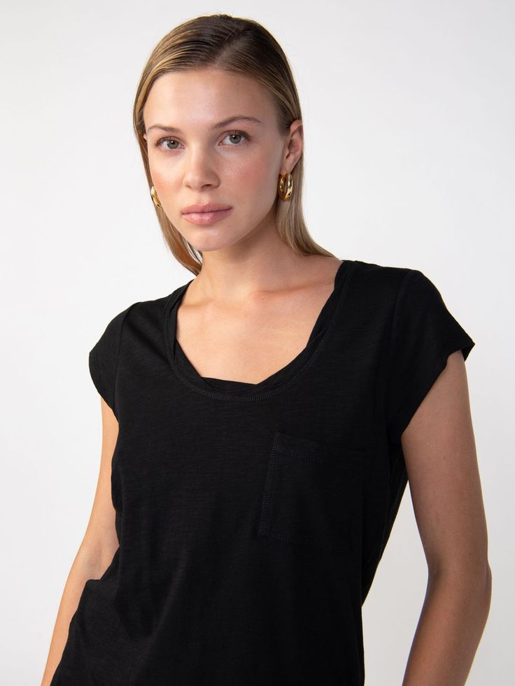 Details The Traveler Twist Tee is sure to be your new wardrobe staple. This ultra-soft cotton slub knit t-shirt has a classic scoop neck, short sleeves, and a loosely fitted bodice. A twisted neck detail brings the final touch to this sustainably made lightweight tee. We won’t blame you if you rock this essential not-so-basic every single day. Pull On Top Front Chest Pocket Scoop Neck with Twisted Detail Lightweight Relaxed Fit Sustainable Available in 1X-3X Size + Fit Model is 5'9 wearing size Black Scoop Neck T-shirt For Everyday, Black Scoop Neck T-shirt, Casual Black Short Sleeve Top With Scoop Neck, Casual Black Scoop Neck Short Sleeve Top, Black Relaxed Fit Short Sleeve Top For Everyday, Travel Tees, Final Touch, Every Single Day, You Rock