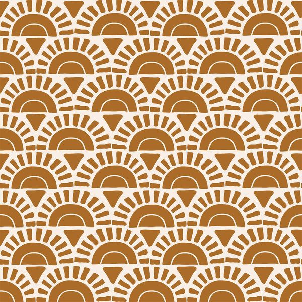 an orange and white pattern with sunbursts