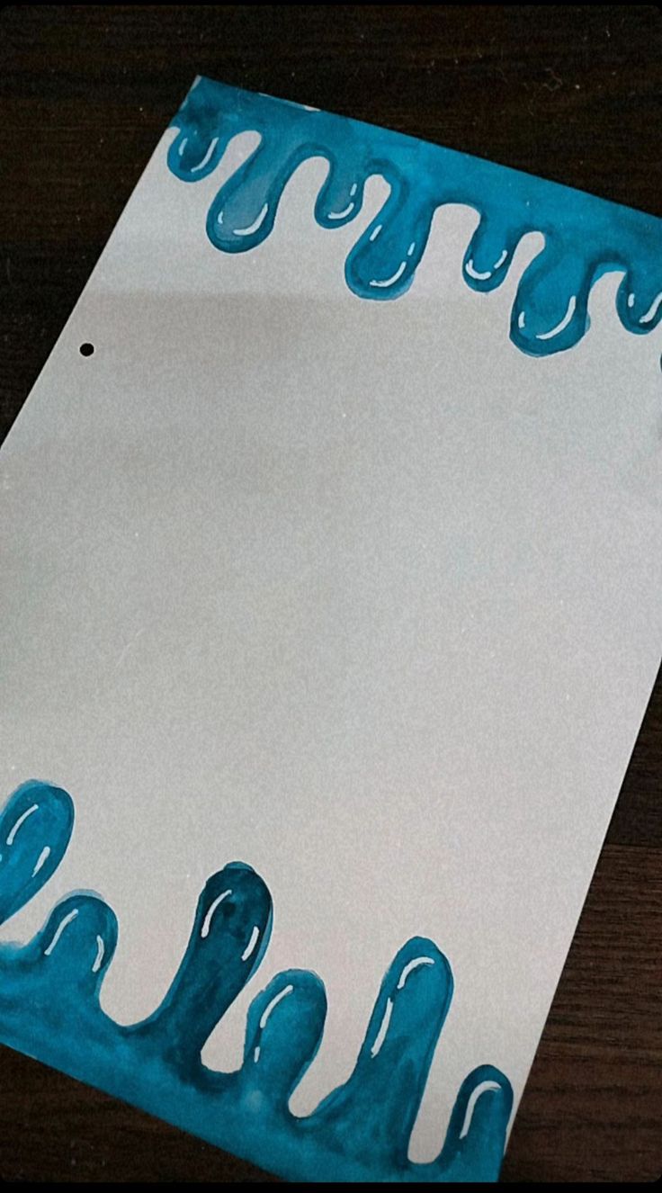 a piece of paper with blue paint on it