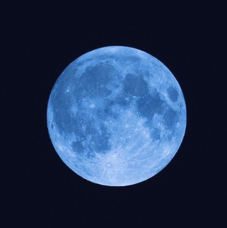 the blue moon is shining brightly in the dark sky