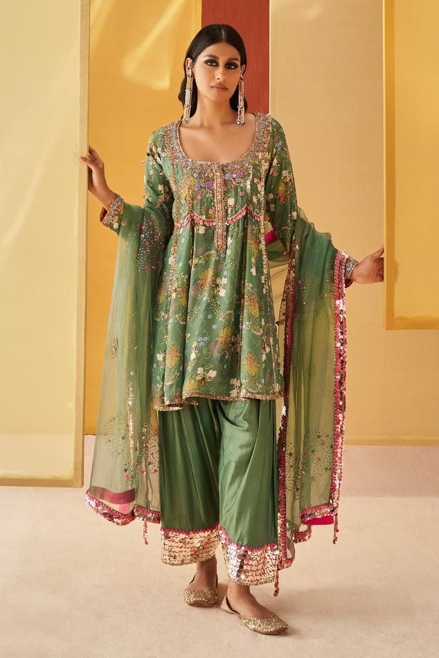 Sage green silk organza short anarkali with floral print and zardosi and pitta embroidery. Comes with salwar and a dupatta.
Components: 3
Pattern: Printed, Embroidered
Type Of Work: Floral, Zardosi, Pitta
Neckline: Round
Sleeve Type: Full
Fabric: Silk organza
Color: Green
Other Details: 
Closure : Anarkali - Drawstrings
Occasion: Mehendi and Haldi - Aza Fashions Pitta Embroidery, Short Anarkali, Sougat Paul, Priyanka Singh, Salwar Pattern, Pakistani Salwar, Palazzo Set, Pants Women Fashion, Fashion App