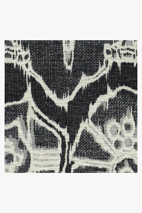 an abstract black and white pattern on fabric