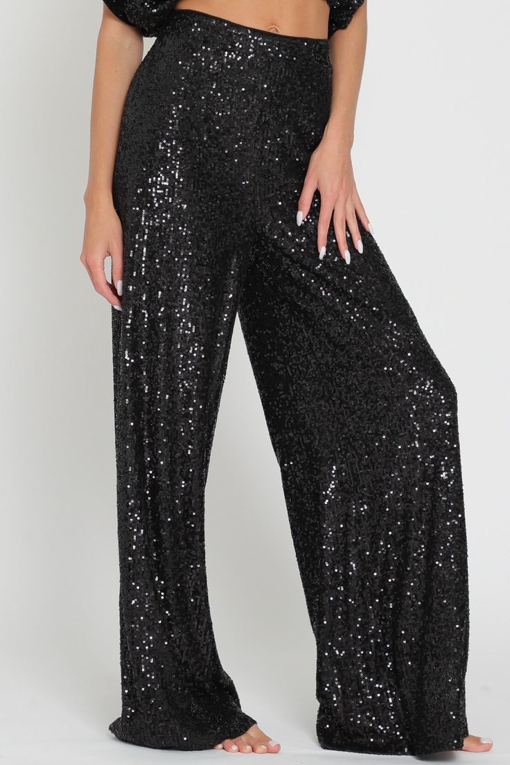 Slip into something sparkly! Our high waisted sequin pants are the perfect party pieces for those looking to glam up their night out - they'll hug your curves and show off your booty! With an elastic back waist, polyester lining, and shimmering sequins, these sleek pants are sure to turn heads. Shine on! Shimmer Bottoms For Party And Holiday Season, Holiday Party Shimmer Bottoms, Fitted Sequin Bottoms For Holiday Party, Glamorous Fitted Bottoms For Holiday Party, Holiday Party Bottoms With Sequins, Glamorous Full Length Party Pants, Holiday Party Sequined Bottoms, Black Sequined Bottoms For Party, High-waisted Wide Leg Pants For Party