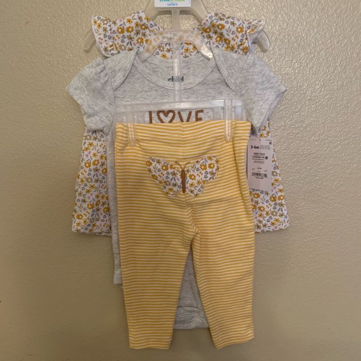 New. Three-Piece Set. One Top. One Short Sleeve Onesie. One Pants Fitted Yellow Onesie With Short Sleeves, Yellow Fitted Short Sleeve Onesie, Yellow Fitted Onesie For Playwear, Cute Yellow Spring Sets, Yellow Onesie For Summer Playwear, Playful Yellow Short Sleeve Onesie, Yellow Onesie For Playwear, Casual Yellow Onesie For Playtime, Cute Yellow Onesie For Playwear