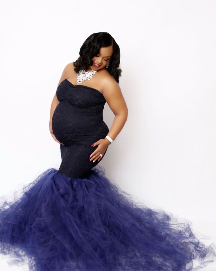 This Sexy Mama Maternity strapless lace tulle maternity gown is absolutely breathtaking. The dress is constructed from premium stretch material on the bodice with a stretchy lace layer over top. The bottom is handcrafted with tulle to create pure elegance that is perfect for both indoor and outdoor shoots. This design is perfect for your maternity photoshoot or any special occasion.  #maternitygown #maternitydresses #bestmaternity #bumpit #prego #maternitysession #maternityphotography Strapless Lace Gown With Sweep Train, Strapless Tulle Gown With Detachable Train, Fitted Tulle Maternity Dress For Wedding, Fitted Tulle Maternity Wedding Dress, Maternity Fitted Gown With Tulle Skirt, Fitted Maternity Gown With Tulle Skirt, Elegant Fitted Tulle Maternity Dress, Elegant Maternity Gown With Tulle Skirt, Mermaid Maternity Dress