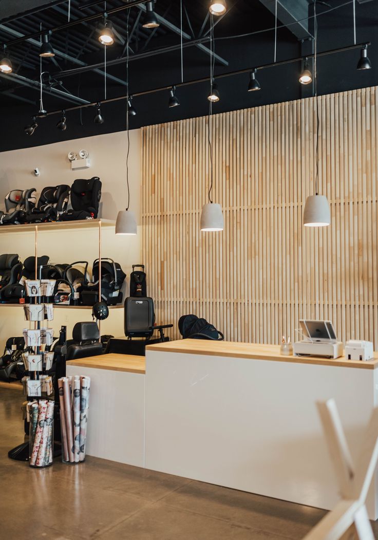 the interior of a shoe store with white chairs