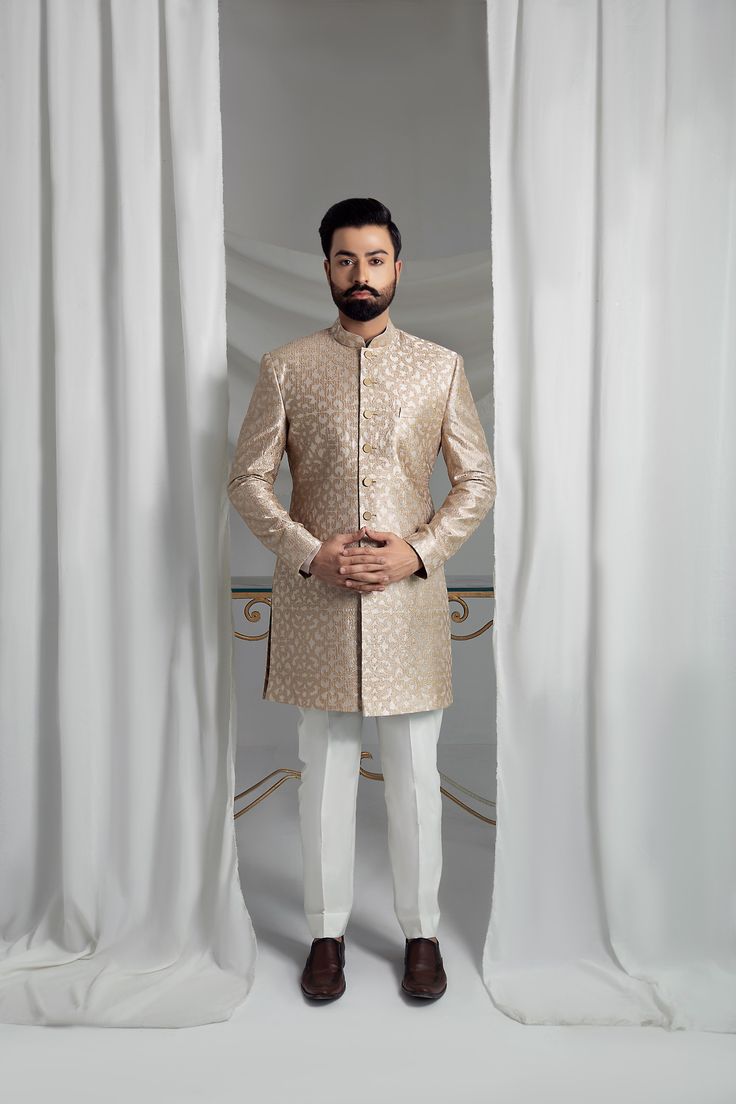 Elevate your formal attire with our Beige Prince Coat. Made from pure atlas material, this coat boasts a luxurious pure silk lining, perfect for any special occasion. The included raw silk kurta pajama and shawl, featuring embroidered borders, complete the elegant look. 4-Piece Suit Elegant Ceremonial Suits With Gold Embroidery, Traditional Long Sleeve Tissue Silk Kurta, Traditional Resham Embroidery Bandhgala For Formal, Traditional Bandhgala With Resham Embroidery, Elegant Bandhgala With Resham Embroidery For Diwali, Designer Long Sleeve Bandhgala For Formal Events, Designer Long Sleeve Bandhgala For Formal Occasions, Elegant Naqshi Tissue Silk Kurta, Elegant Semi-formal Sets For Eid