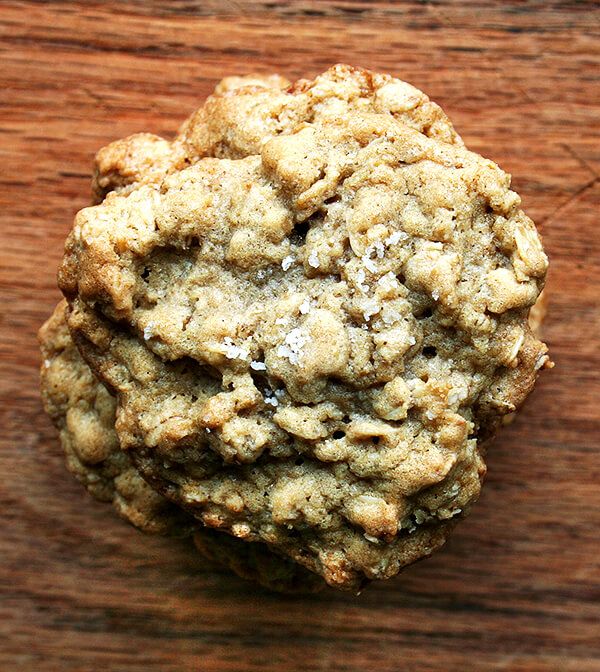 an oatmeal cookie sitting on top of a wooden table