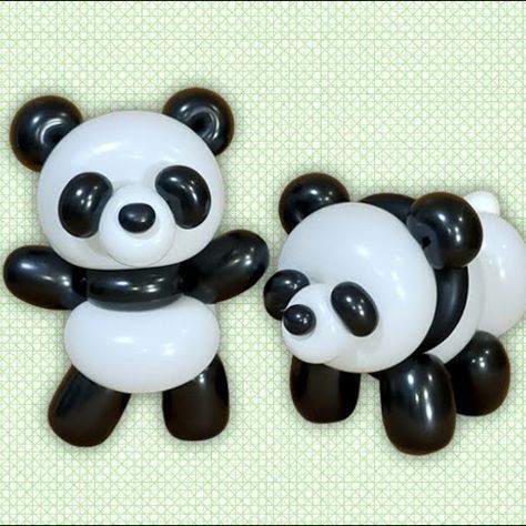 two black and white balloons shaped like panda bears