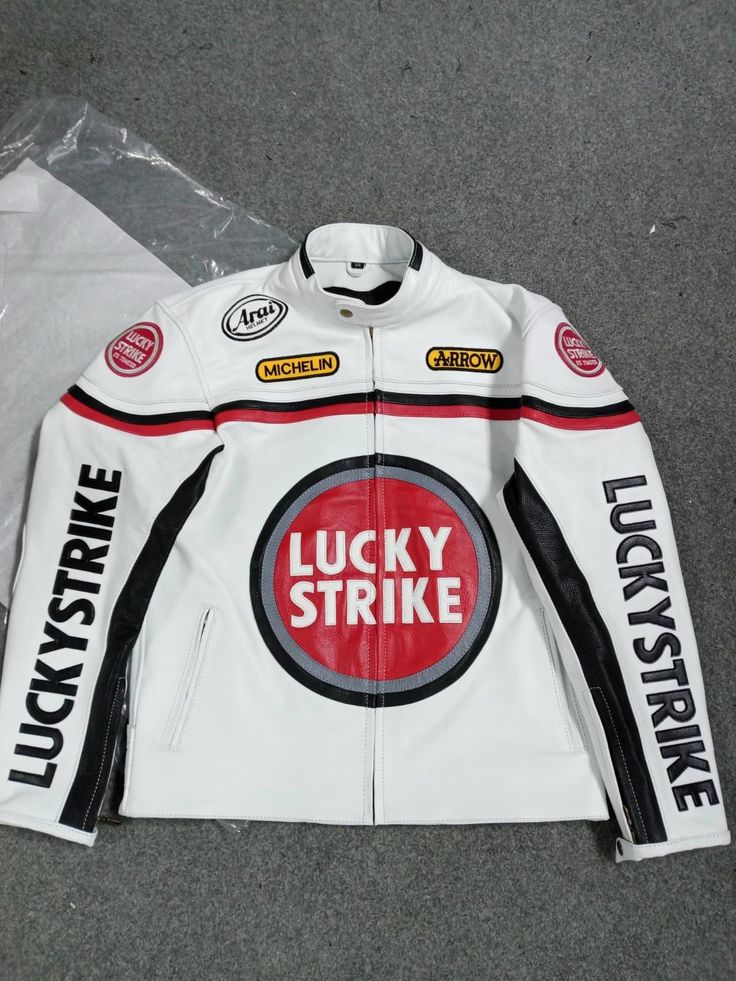 🔥 Vintage Lucky Strike Leather Jacket 🔥 Step back in time with our Vintage Lucky Strike Leather Jacket! 🕰️✨ This iconic piece is a perfect blend of classic style and rugged durability. 💪🧥 Crafted from premium full-grain leather, it promises not only a unique look but also unmatched longevity. 🛠️🕶️ The jacket features: A rich, deep patina that only comes with age, giving each piece a one-of-a-kind charm. 🎨✨ Sturdy zippers and snap buttons for a secure fit. 🔒🧲 Multiple pockets for all your essentials. 🗝️📱 A comfortable, well-worn feel that makes it perfect for any occasion. 🌟👕 Whether you're hitting the open road 🛣️🏍️ or just want to add a touch of vintage cool to your wardrobe, this Lucky Strike jacket is the ultimate choice! 🎯💼 Don't miss out on owning a piece of fashion Retro White Biker Jacket For Winter, Retro White Biker Jacket For Fall, White Winter Outerwear For Biker Events, Classic Hooded Leather Jacket, Casual White Motorcycle Outerwear, White Outerwear For Biker Events In Fall, White Fall Outerwear For Biker Events, Fall Motorcycling White Outerwear, Classic White Leather Jacket With Long Sleeves