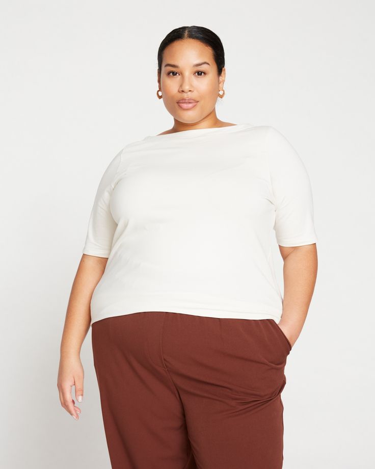 The Bella Boatneck Tee is the effortless and covetable top ready to be styled in every way. Made from super soft Peruvian cotton that feels so good, you'll never want to take it off. Designed with an elegant, wide boatneck (that still covers your bra straps) and a longer hem that you can scrunch up or tuck into your favorite bottoms. It's all in the little details. Fit: Fitted, view the product size guide Fabric: 93% Pima Cotton, 7% Elastane Care: Turn inside out, machine wash cold, lay flat to Effortless Oversized Top For Layering, Relaxed Fit Tops For Layering, Effortless Top With Shirttail Hem, Effortless Tops With Shirttail Hem, Effortless Shirttail Hem Top, Oversized Cotton Tops, Oversized Versatile Top, Versatile Relaxed Fit Knit Top For Loungewear, Relaxed Stretch Cotton Tops