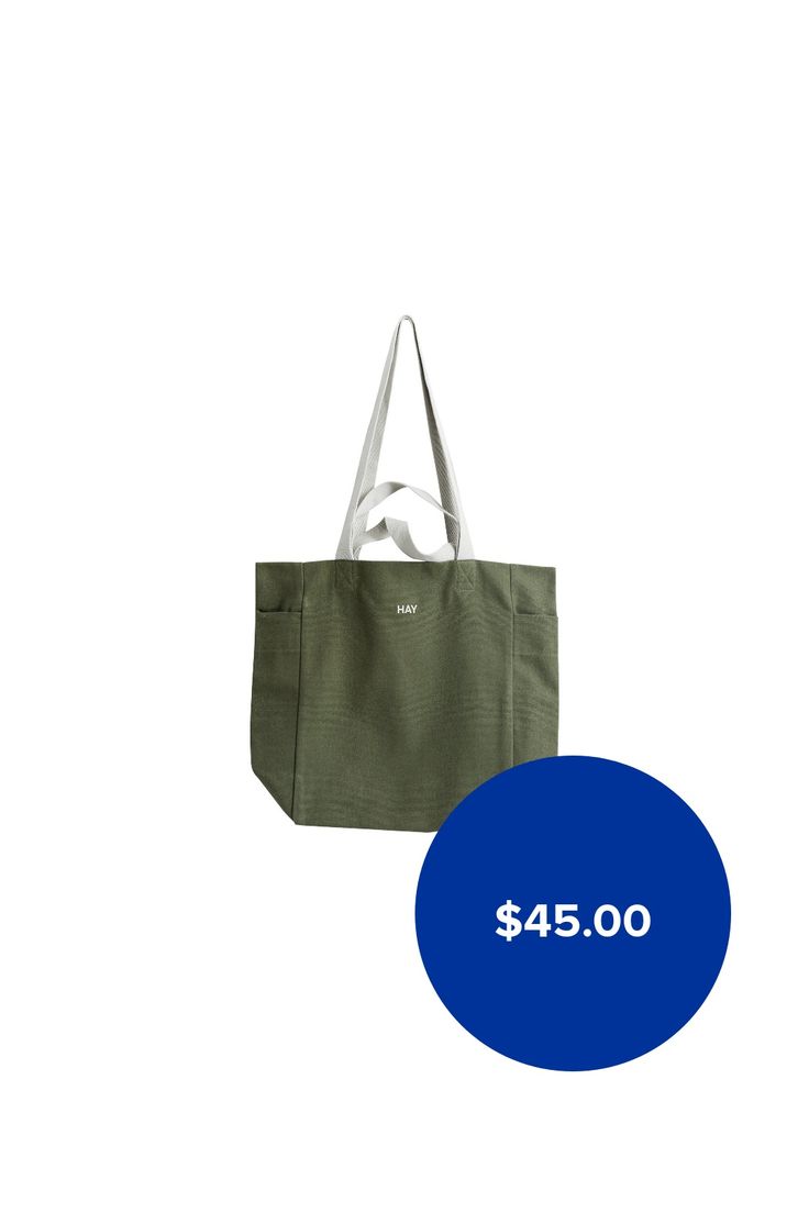 HAY's Everyday tote bag is a carefree companion for summery trips to the beach or a grocery haul. The large canvas tote has a clever pocket on each end and on the inside for keeping smaller items within reach. Two sets of handles in different lengths make the Everyday bag easy to carry: let it hang on your shoulder or just grab it and go. Perfected with HAY's logo, the colourful Everyday cotton bag is also perfect for organizing – use it as a laundry bag or as storage for kids' toys, for exampl… Large Capacity Khaki Beach Bag For Travel, Khaki Large Capacity Beach Bag For Travel, Green Canvas Bag With Canvas Lining For Travel, Khaki Tote Beach Bag For Everyday, Khaki Tote Beach Bag, Everyday Canvas Tote Beach Bag, Canvas Tote Beach Bag With Pockets, Green Rectangular Canvas Bag For The Weekend, Green Rectangular Canvas Bag For Weekend